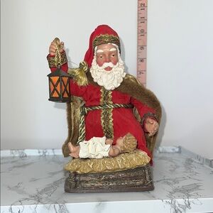 Vintage Santa Claus Figurine with Lantern admiring Baby Jesus